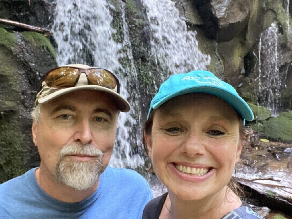 Erik and Vesna in front of a waterfall