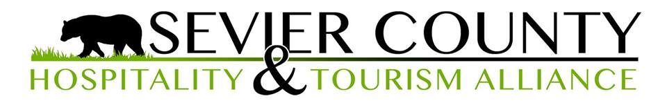 Logo for Sevier County Hospitality and Tourism Alliance. A Walk in the Woods won Attraction of the Year for 2025!