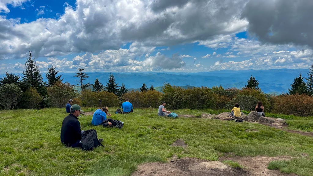 Group sitting on Andrew's Bald, soaking up the views.