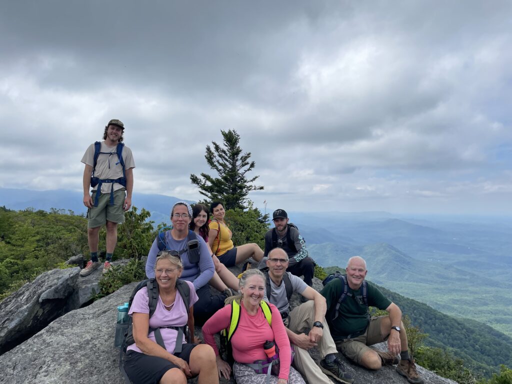 Guide and guests atop Mt Cammerer, taking in the amazing views. Smoky Mountains Wilderness Basecamp