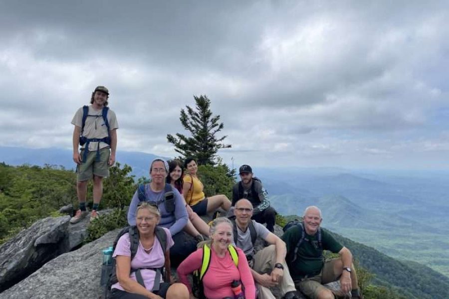 Guide and guests atop Mt Cammerer, taking in the amazing views. Smoky Mountains Wilderness Basecamp
