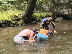 guide and guests snorkeling in the river